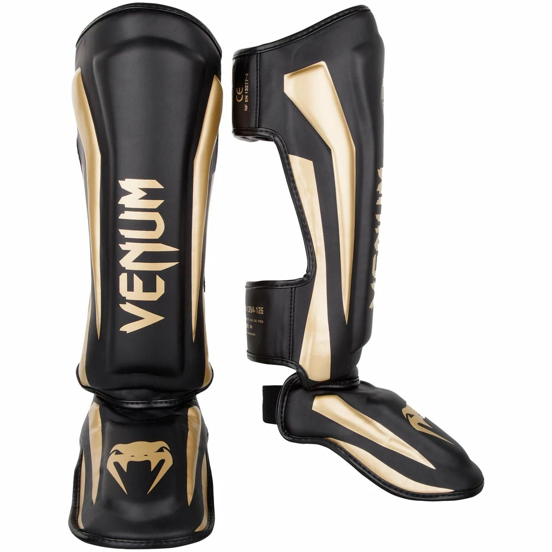 Playwell Venum MMA Shorts & Clothing Venum Muay Thai Stand Up Elite Shin Guards - Black/Gold 1 Playwell Venum MMA Shorts & Clothing Venum Muay Thai Stand Up Elite Shin Guards - Black/Gold